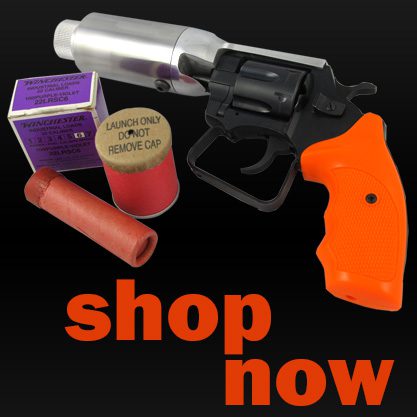 Starter pistol with orange handle and ammunition